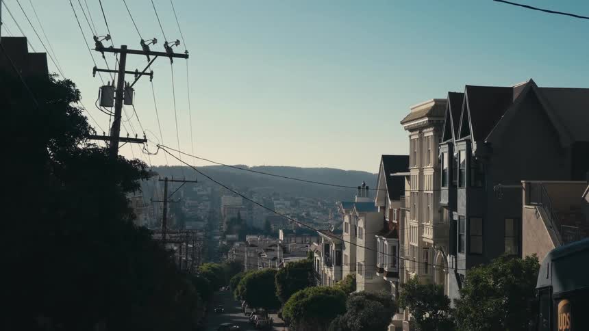 Townhouses along a road in a city during the day
