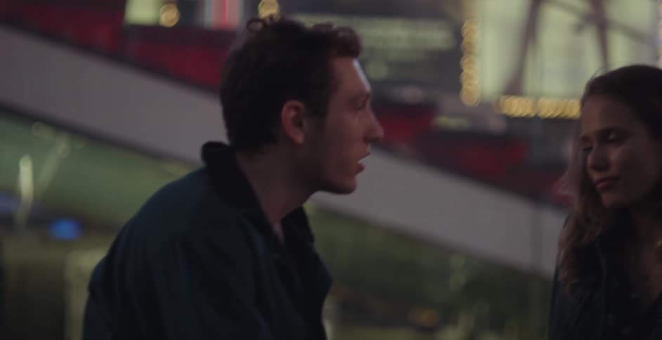 A man and women talk at night