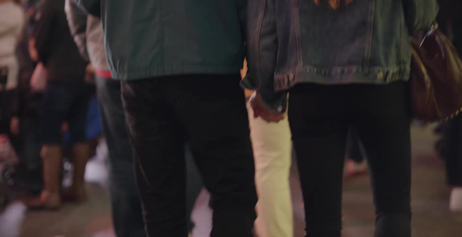 A group of people are walking forward
