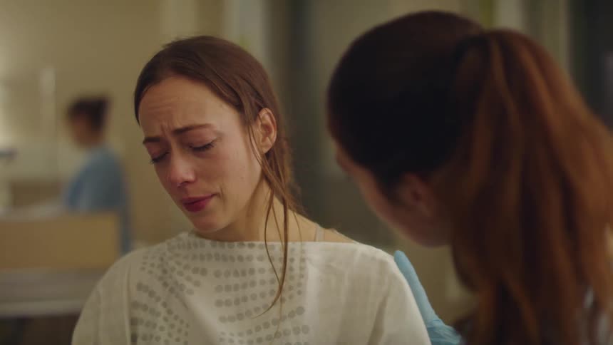 Nurse hugs patient as she starts crying while in hospital