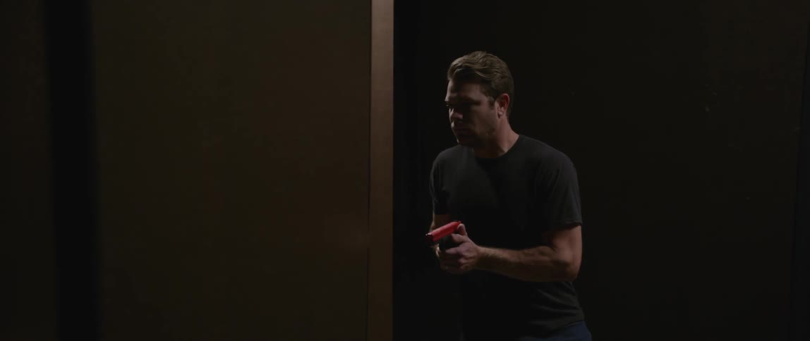 A man with a fake gun goes through an obstacle course