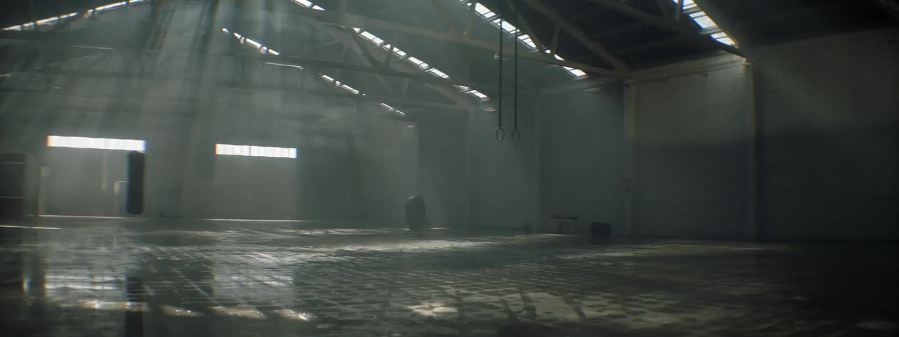 The sun shines through roof of empty building