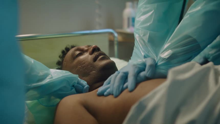 A doctor performs chest compressions on a passed out patient