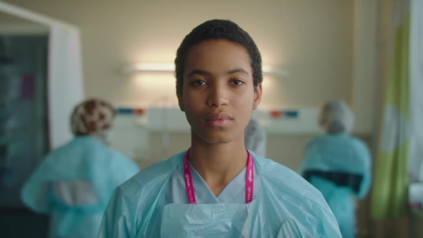 Portrait of a young nurse in a hospital setting during the day