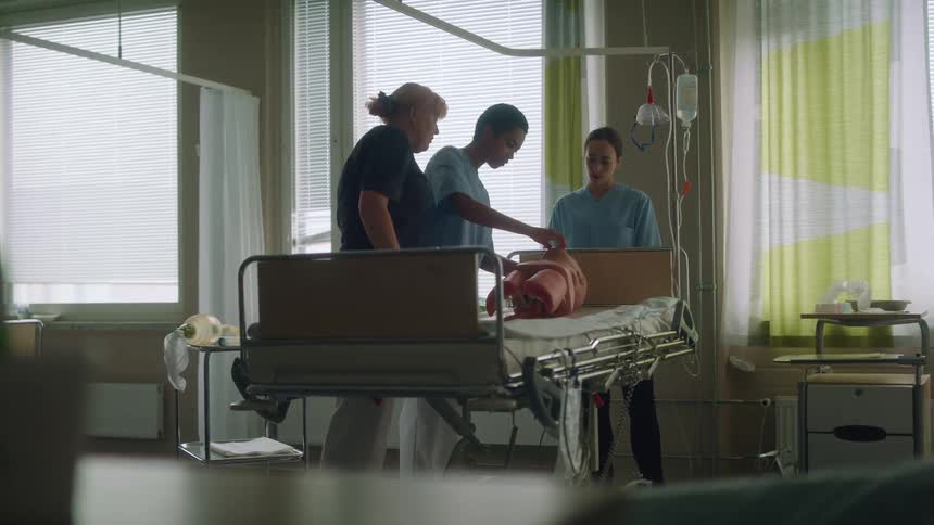 Doctors practice on a medical dummy