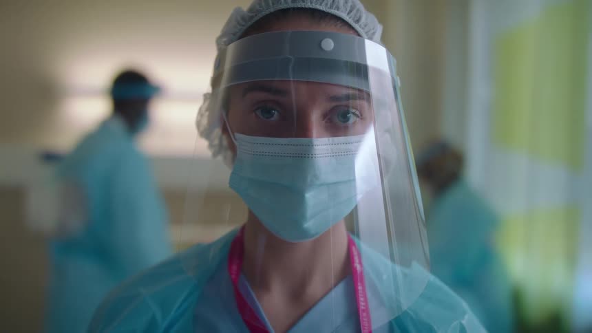 A woman standing in a hospital