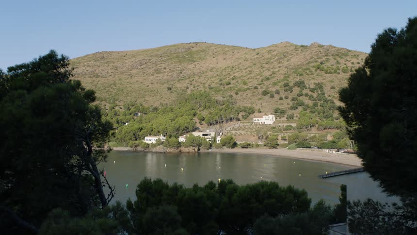 A view of a lake with a beach around it