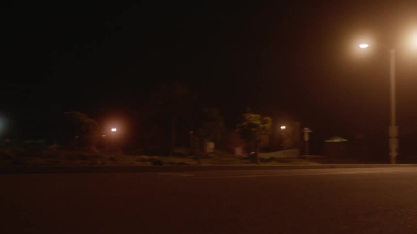 A car driving by at night