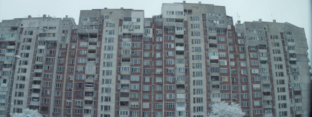 Apartment buildings in a metropolis on a snowy day during the winter season