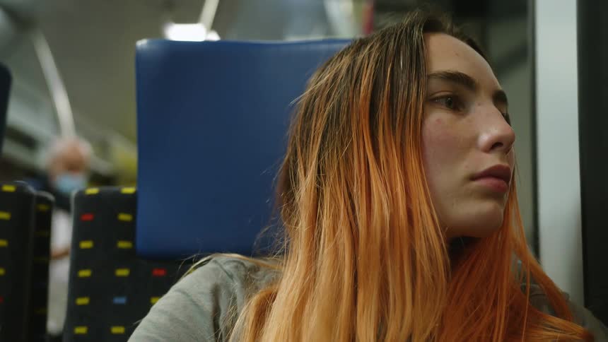 A woman riding on a train