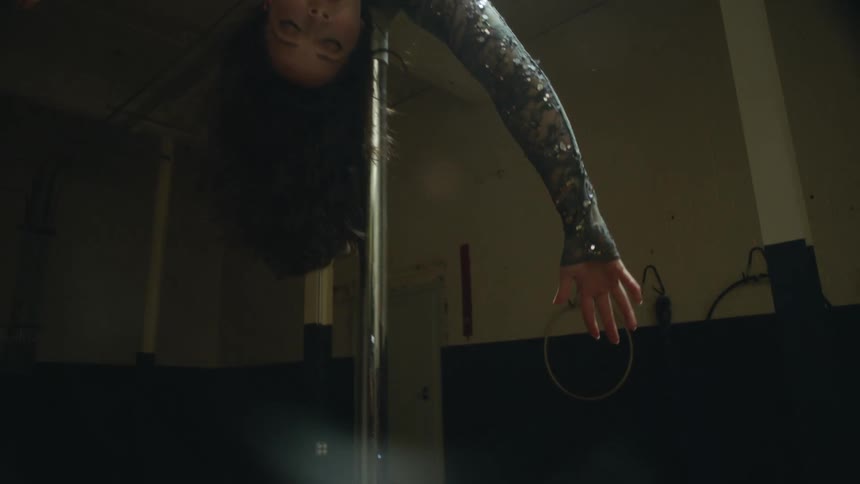 A gymnast doing exercises on a ring