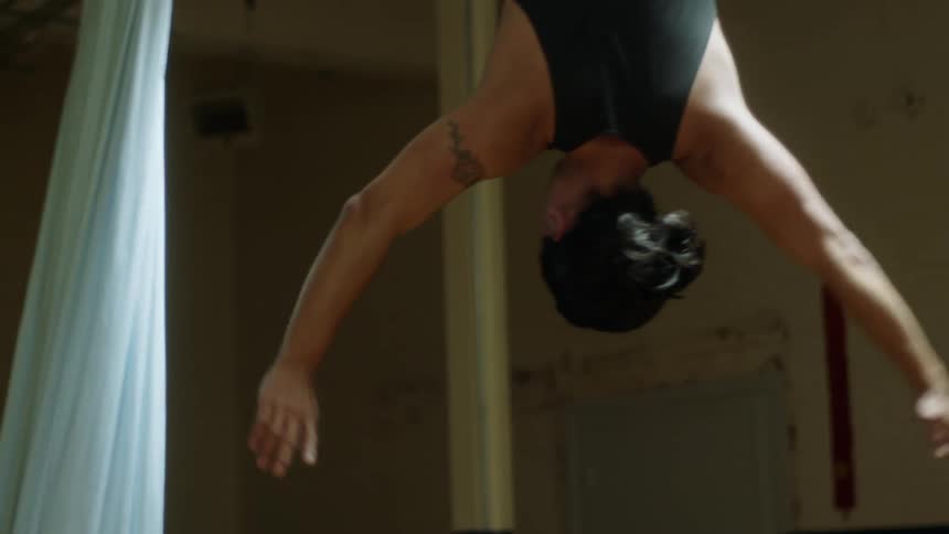 A man doing acrobatics in a room