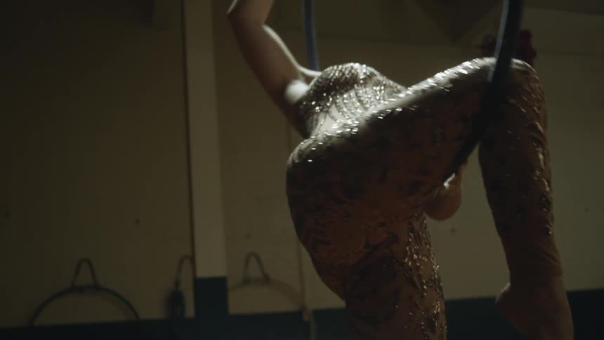 A woman doing acrobatics in a room