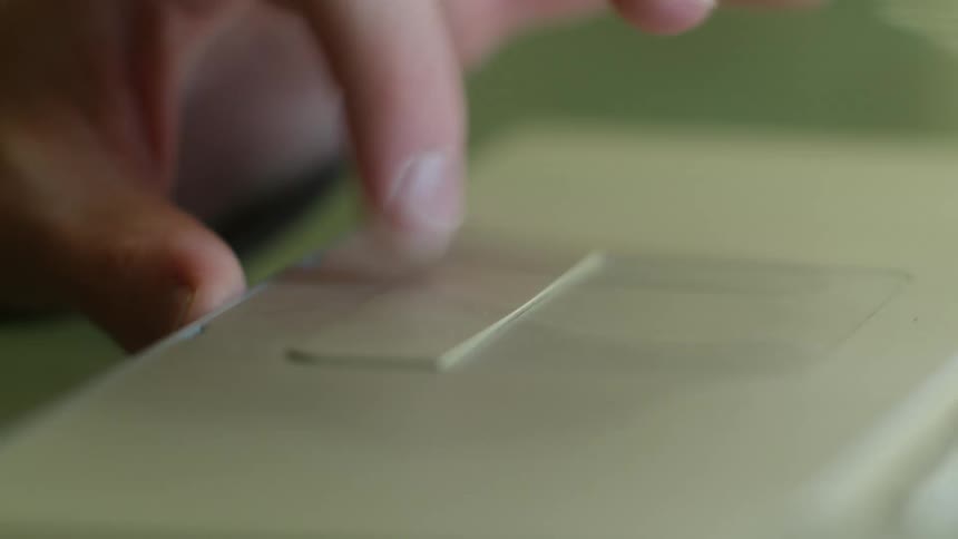 A person typing on a laptop