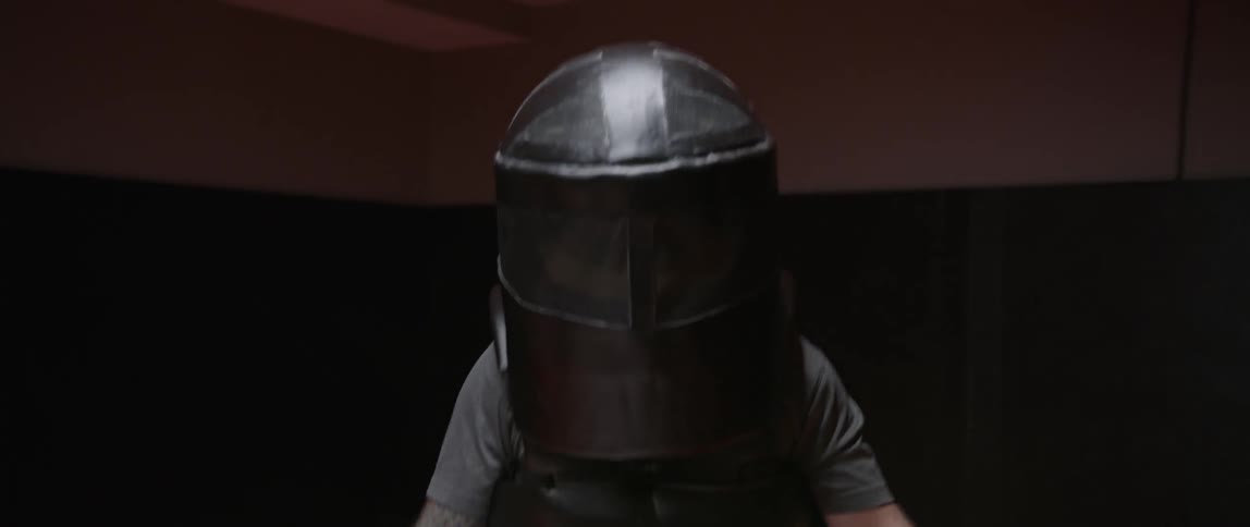 Person wearing padding ready to spar indoors