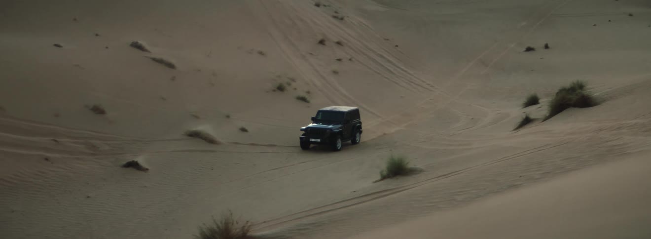 A vehicle driving in the desert