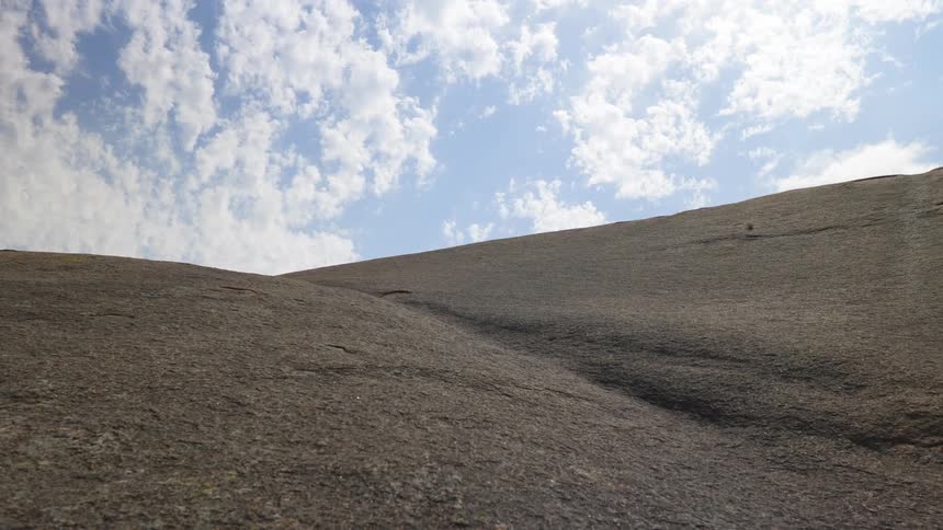 The top of a rock surface on a cloudy day