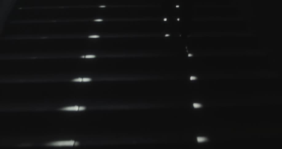 Person goes up dark underground stairs