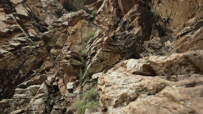 Aerial view down a rocky mountain ravine