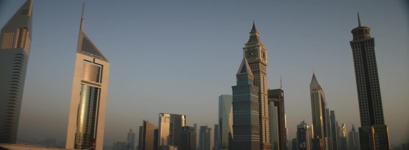 Dubai skyline with buildings and skyscrapers with the sky and clouds in the background