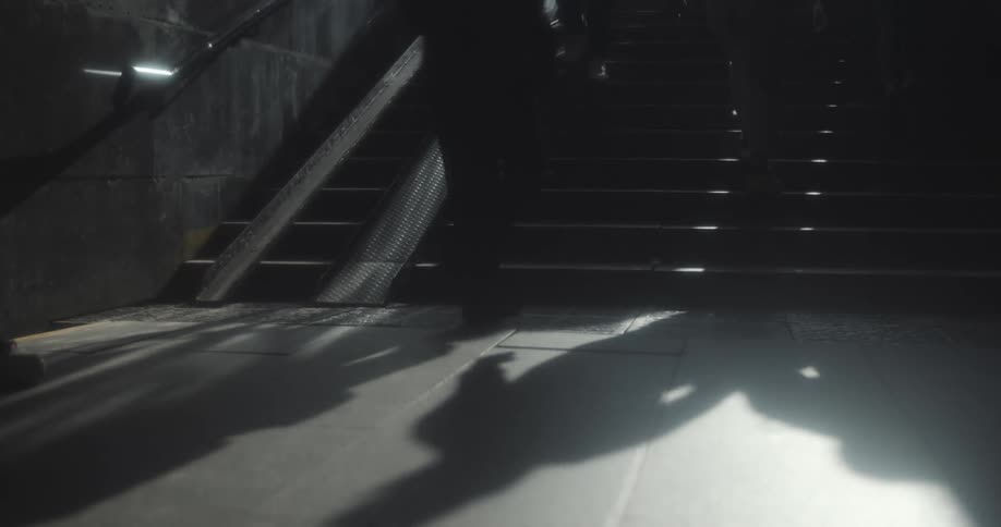 A group of people goes up and down underground stairs