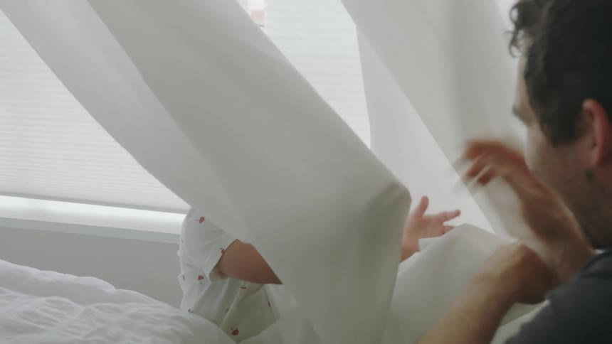 A father and son playing in their house