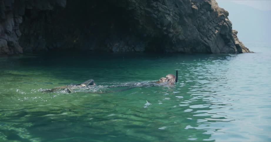 A woman snorkeling outdoors
