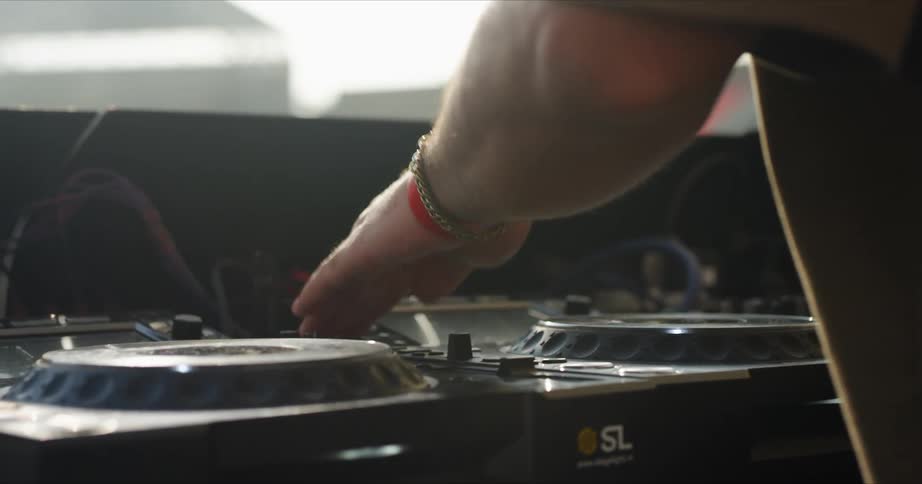 A musician is getting his sound equipment ready
