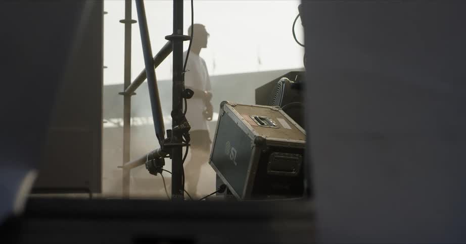 A man is dancing on the smoke filled stage