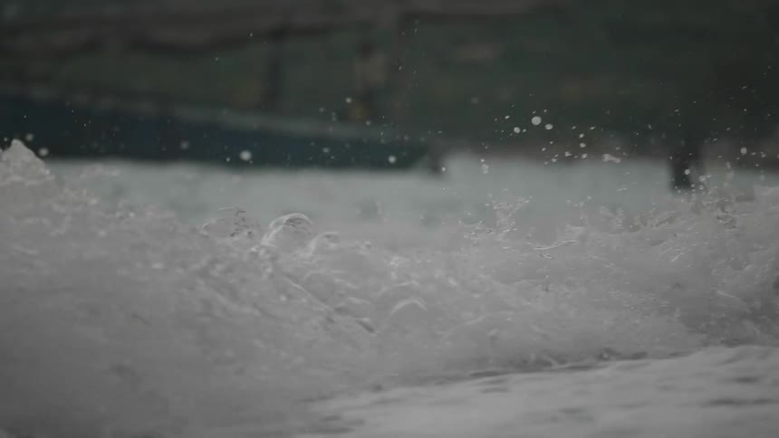River water gushes down a stream on the other side of a dam