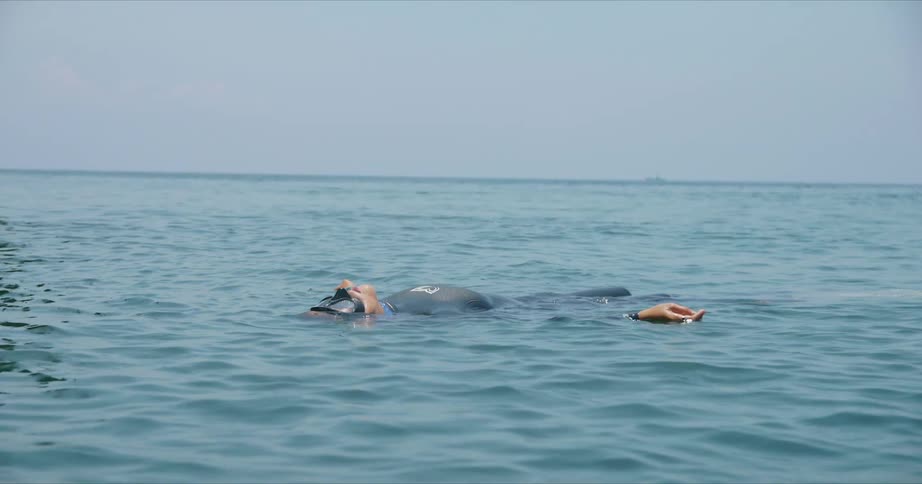 A person is floating in the ocean