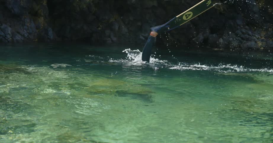 A woman diving and swimming in the water