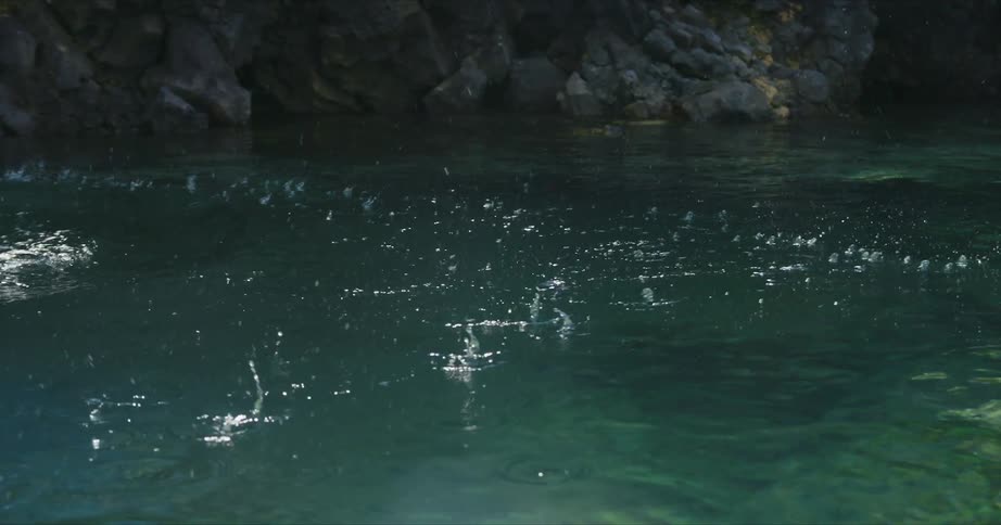 Drops falling into the water in the ocean