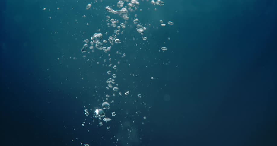 An abstract visual of bubbles rising in water with a blue gradient background