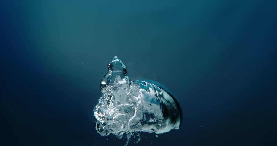 Air bubbles are rising through the water