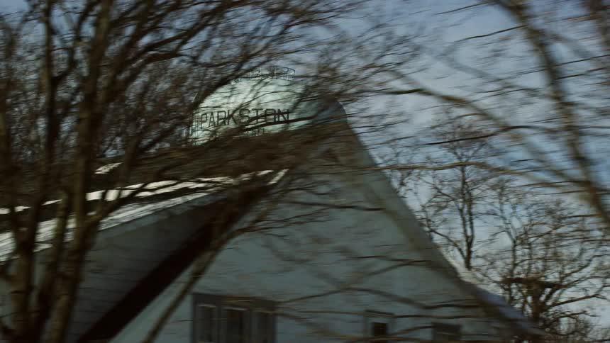 A water tower outside a neighborhood bears the name of the small town