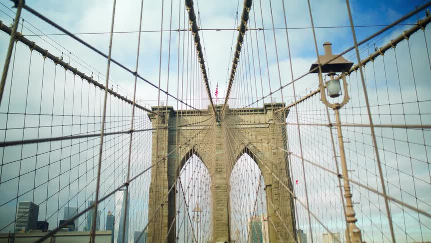 A close up view of the architecture of a suspension bridge