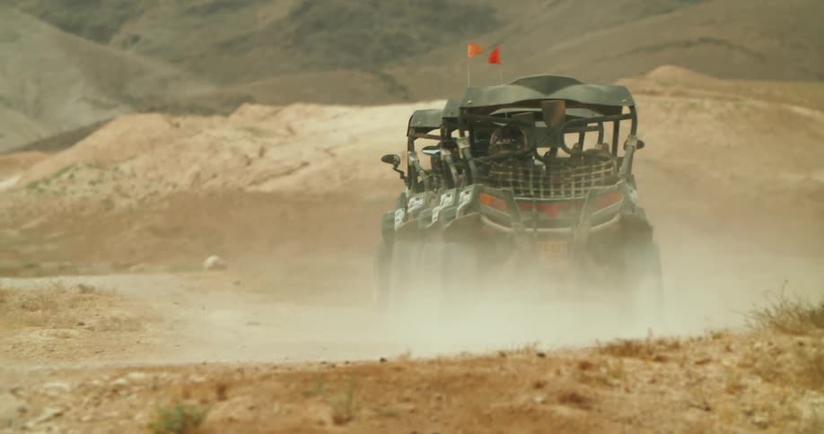 A group of offroad buggies driving out