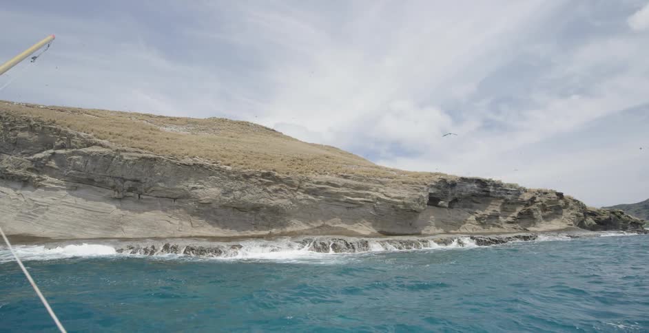View of the shore from the water on a cloudy day