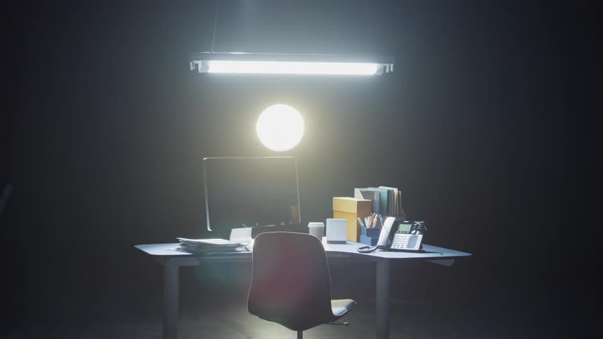 Desk with a light being lit
