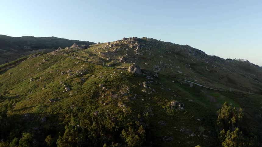 A tall mountain is covered with boulders