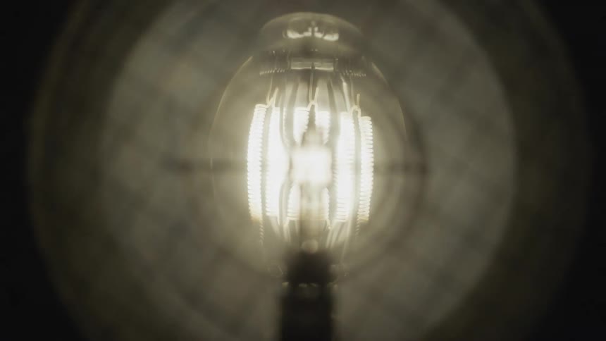 A lamp as it turns on and becomes very bright and then turns off again