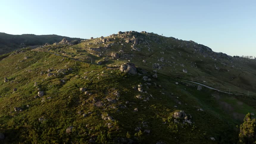 An aerial view of a mountain with rocks