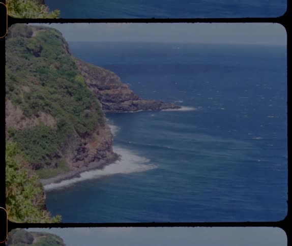 View of oceanside cliffs with blue water