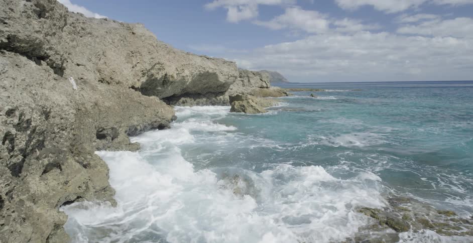Waves crash onto a rocky shore