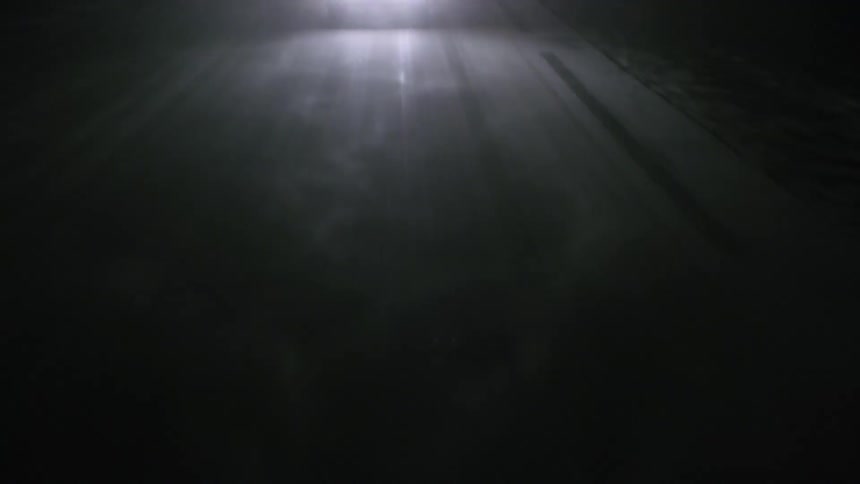 Lights are moving down an icy dark road