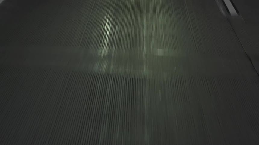 Road surface reflects electric light in center of lane