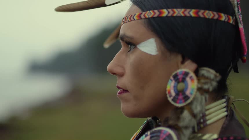 A portrait of a woman standing outdoors
