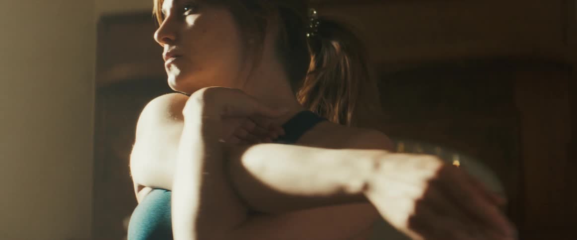 A woman stretching at home