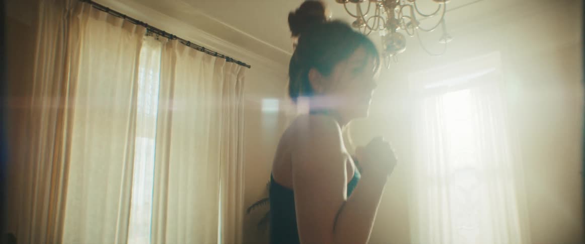 A pregnant woman exercises at home